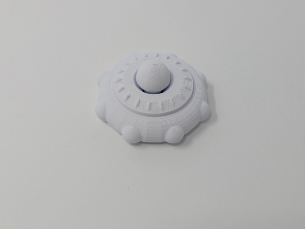 UFO Biçimli Küçük Fidget Spinner (Ortası Yarım Küreli, Kenarı Çıkıntılı)