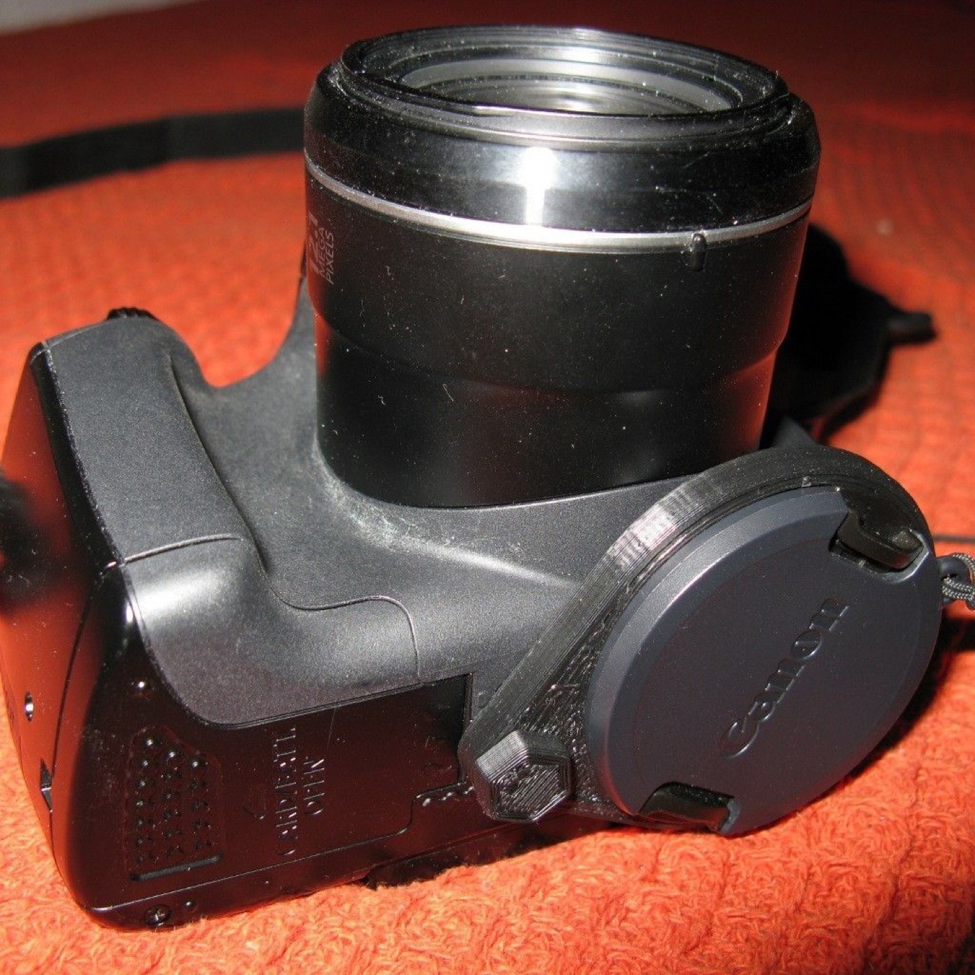 Kamera Alt Tripod Yuvasından Takılan Lens Kapağı Tutucusu